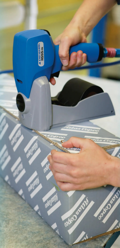 Roll stapler with roll magazine